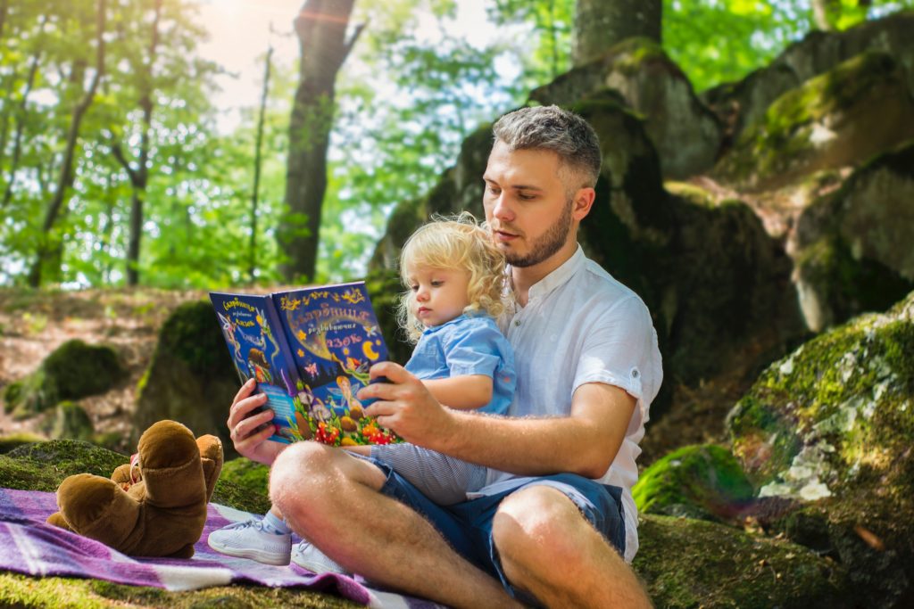 father and daughter reading together