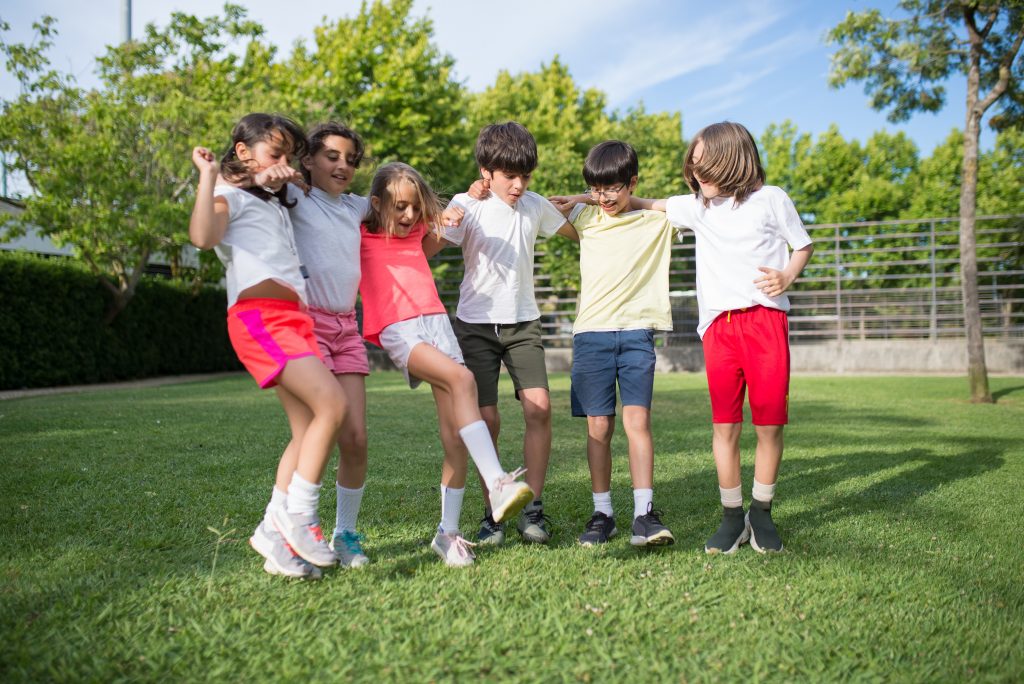 group of kid friends on a field