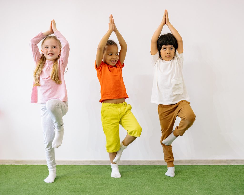 3 kids doing yoga